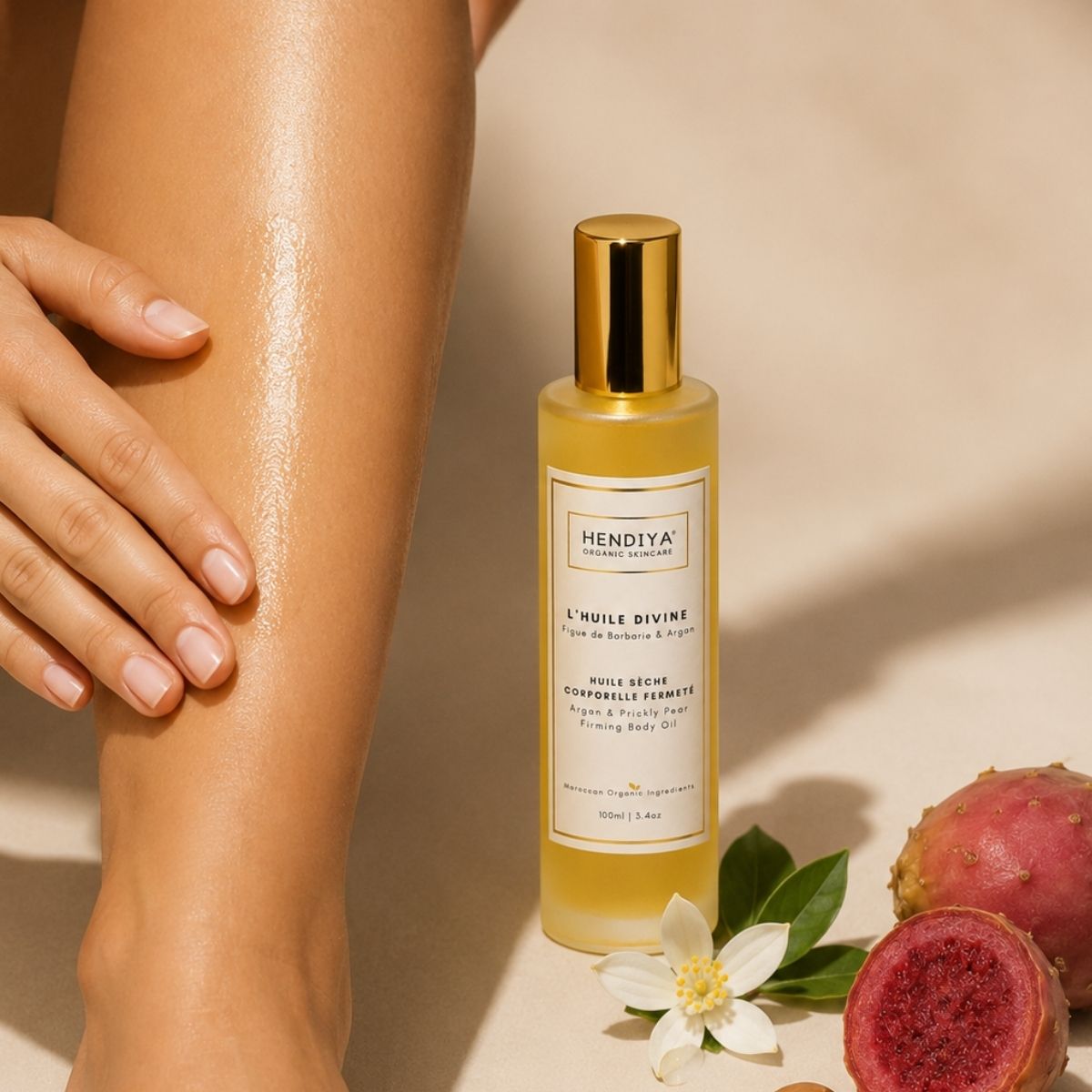 Applying L'Huile Divine Hendiya® to the skin, firming dry body oil