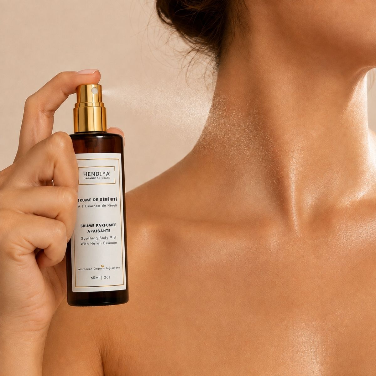 Applying Brume de Sérénité Hendiya® to the skin, neroli mist