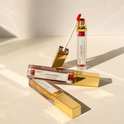 Range of tinted lip skincare by Hendiya, including L'Huile Intuitive